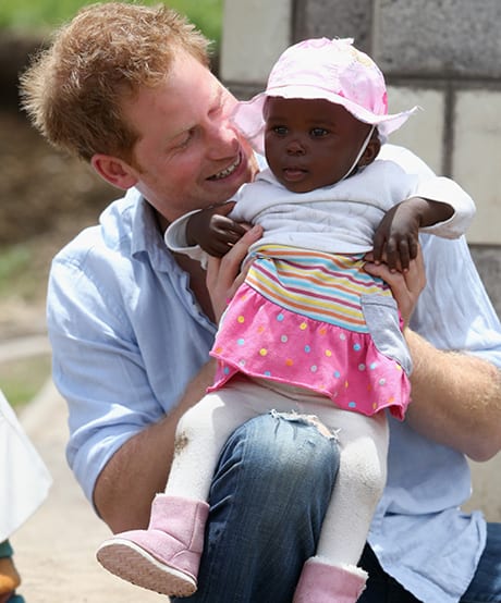 December 8, 2014: Prince Harry Holds a Baby in Lesotho, South Africa